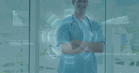 Standing physician wearing scrubs, stethoscope before large glass windows, showing digital overlays
