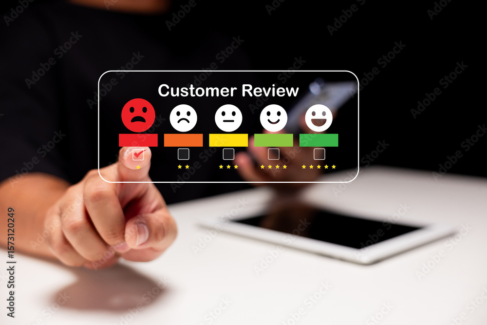 Poster a person selects a negative customer review rating on a digital interface, highlighting dissatisfact