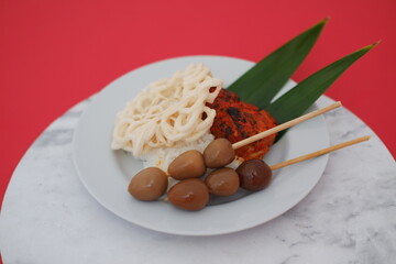 Authentic Indonesian Dish with Grilled Chicken and Quail Eggs
