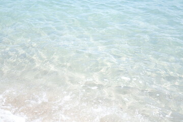 Gentle Waves Washing Over White Sand