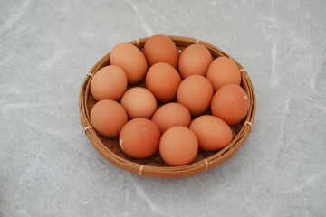 Organic Brown Eggs on Bamboo Plate