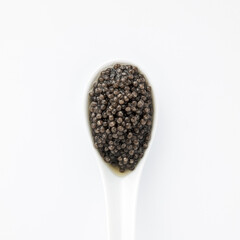 Luxury sturgeon black caviar, gourmet seafood served separately on white dishware, clean top view, culinary elegance and high-end presentation. Vitamin Omega 3. Healthy Food for Human Health