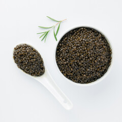 Luxury sturgeon black caviar, gourmet seafood served separately on white dishware, clean top view, culinary elegance and high-end presentation. Vitamin Omega 3. Healthy Food for Human Health