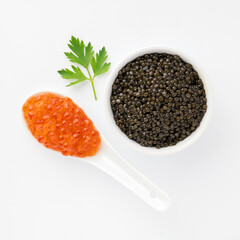 Black caviar in small bowl, red salmon roe in spoon, garnished parsley, isolated clean white background, luxury seafood concept, minimal food aesthetic, gourmet composition. Healthy Food for Human