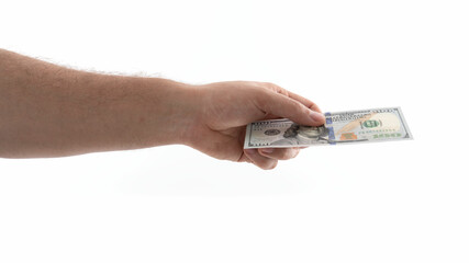 Hand extending cash currency in a neutral setting