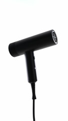 Compact black hair dryer on a white background