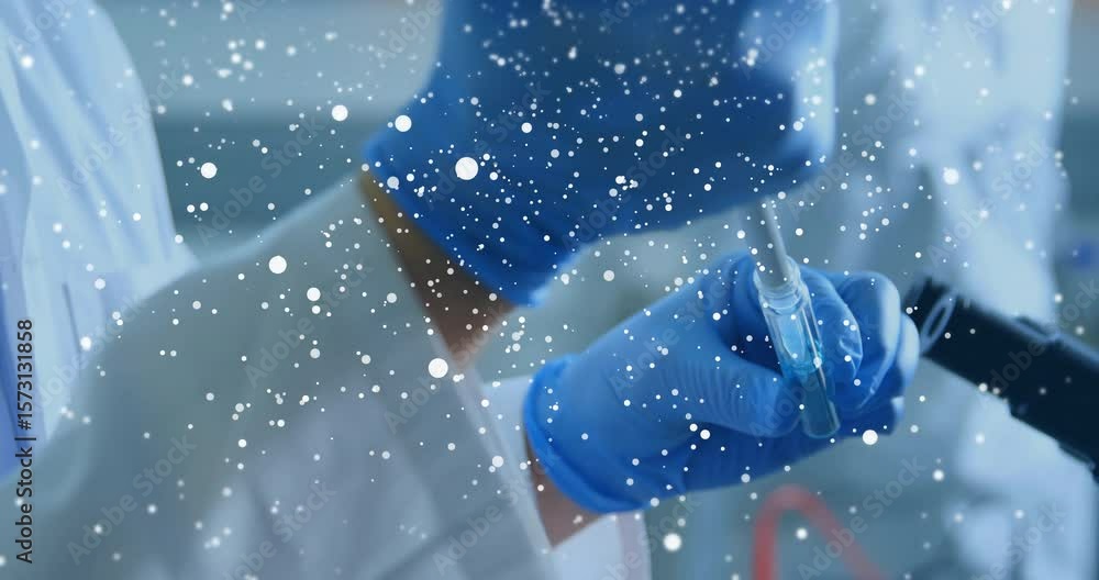 Poster pipet dipping in blue dye, hands drawing and adding to tube to analyze while particles intensifying