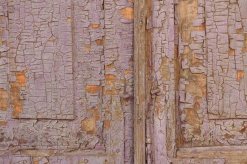 Close-up shot of a old wooden background with paint peeling off