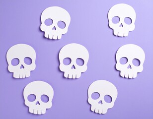Fototapeta premium 3D halloween white paper skulls on a plain purple background, autumn fall skeleton wallpaper with copy space for text