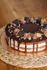 Chocolate homemade cake with icing and cream, festive birthday dessert