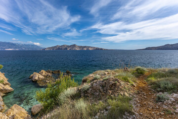 The picturesque bay and pebbly empty beach of beach Vreženica on the island of KRK,