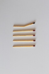 Burnt and Bent Matchstick Among New Ones: Symbol of Weakness or Collapse