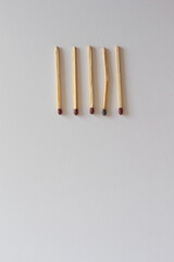 Burnt and Bent Matchstick Among New Ones: Symbol of Weakness or Collapse