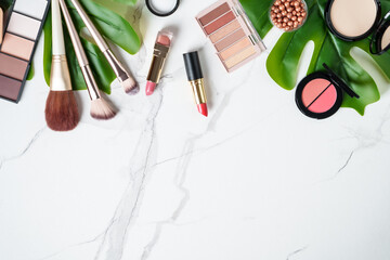 Cosmetic products on white background.