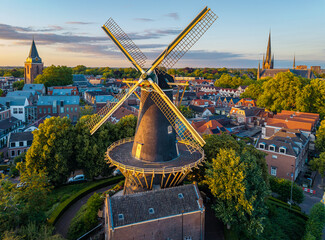 Aerial View of Woerden at Sunset with Historic Dutch Windmill De Windhond and two Churches