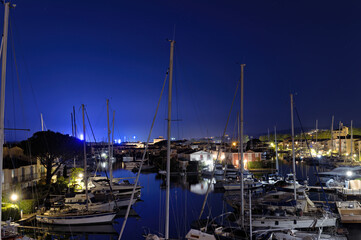 View over Port Grimaud marina in France in spring with yachts and sailing boats at night