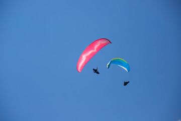 Paragliders above the alps in the dolomites, South Tyrol