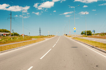 Empty asphalt roadway in country in summer
