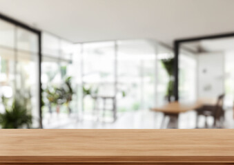 blurry bakground modern office interior with wooden top table
