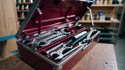 High-Quality Metal Tool Box with Various Wrenches and Bright Background of Workshop Storage Space