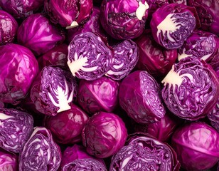 Obraz premium Flatlay closeup of fresh cut red cabbage heads as background.