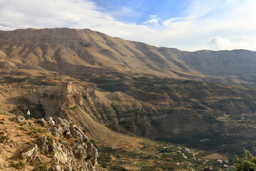 Naklejka premium Woman on Cliff with Panoramic View of Lebanese Mountains