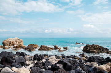 Rocky Coastline with Ocean and Cloudy Sky