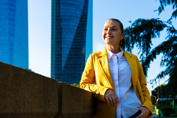 Senior businesswoman wearing business casual attire in the city