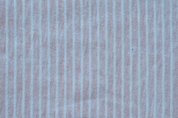 Top view photo of  pink and white striped organic cotton knitted fabric