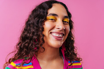 Creative studio portrait of beautiful hispanic woman with diastema