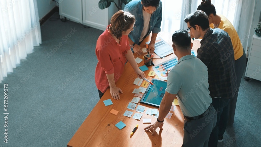 Poster time lapse of manager writing idea on sticky note and explain idea about web design. professional ma