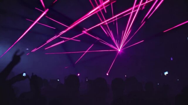 Dynamic Laser Show with Vibrant Pink Lights in a Dark Ambient Nightclub Atmosphere