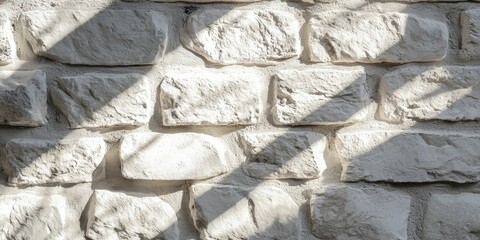 Detailed white stone facade under soft sun rays, casting gentle shadows