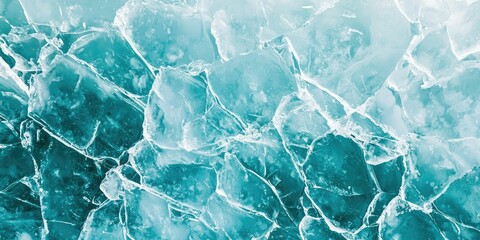 Fractured white ice with visible diagonal line on teal background surface