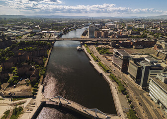 Glasgow Scotland: 18th May 2025: Drone view of Glasgow skyline on River Clyde with Bridges on a sunny day aerial view