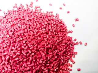 plastic masterbatch, oncolor red polymer masterbatch type cold cutting raw material granular, isolated on white background, for product catalog design of plastic manufacturing industry company profile