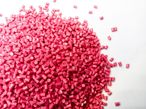 plastic masterbatch, oncolor red polymer masterbatch type cold cutting raw material granular, isolated on white background, for product catalog design of plastic manufacturing industry company profile