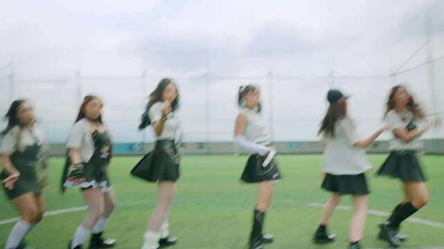 Energetic Dance Performance on Sports Field