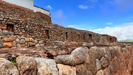 Ancient Inca Stone Walls at Chinchero Archaeological Site, Peru under Blue Sky