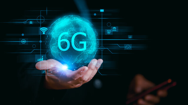 Businessman holding global network connection on 6G technology and futuristic advancement, uture technology 6G network internet of thinks connection communication, high-speed internet network signal.