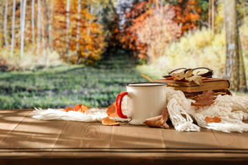 Still life composition on rustic wooden table, set against the backdrop of an autumn forest. Fallen...