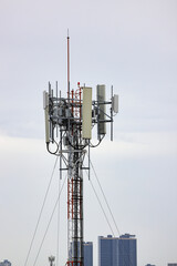Wireless Communication Antenna pole, Mobile phone mast antenna pole on top of dilapidated building