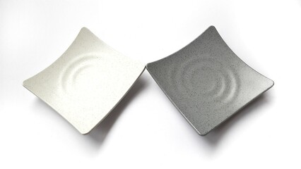 Empty square white and grey plates with ceramic melamin material isolated on white background