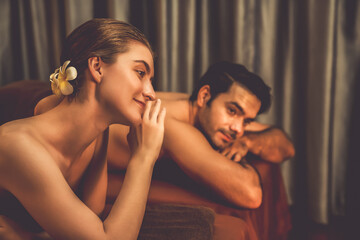Caucasian couple customer enjoying relaxing anti-stress spa massage and pampering with beauty skin...