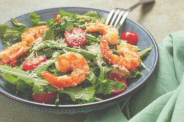 Shrimp salad with arugula and cherry tomatoes, with parmesan cheese, healthy food,