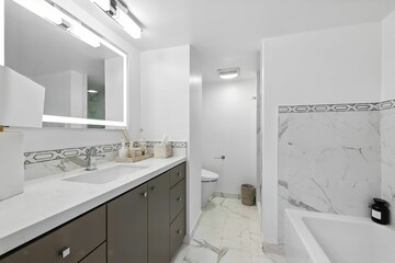 Stylish High-Rise Condo with City Views, Modern Kitchen, and Elegant Light-Filled Living Spaces
