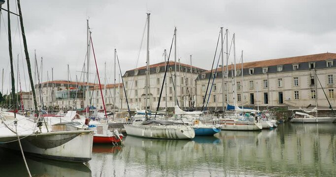 Rochefort Marina in Charente-Maritime. Lap&eacute;rouse Basin along Royal Navy Residence with beautiful sailboats seen from Dock le Moyne de S&eacute;rigny

