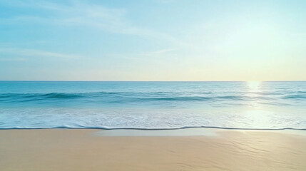 Serene beach scene with gentle ocean waves reflecting soft glow of sunset, creating tranquil and peaceful atmosphere under clear blue sky
