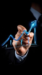Businessman drawing a growth graph line with a marker on a virtual screen background