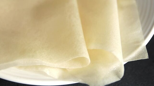Dough brik raw thin sheet packaging dough phyllo fresh gourmet food background on the table rustic food top view copy space